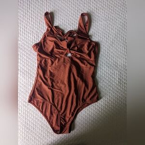 Brown one piece Geode swimsuit tie front.